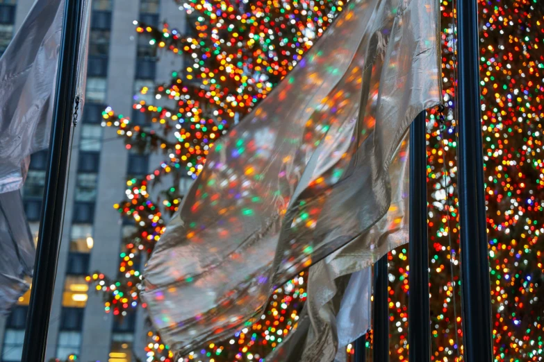 a large christmas tree decorated with multi colored lights