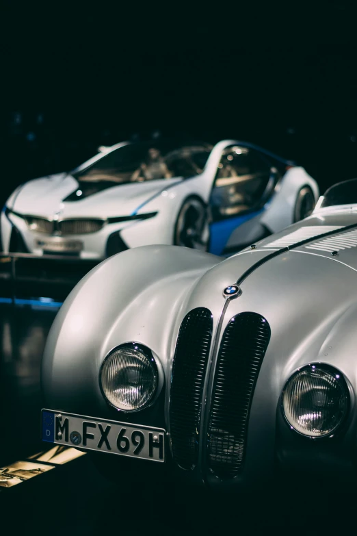 the front end of two shiny sports cars