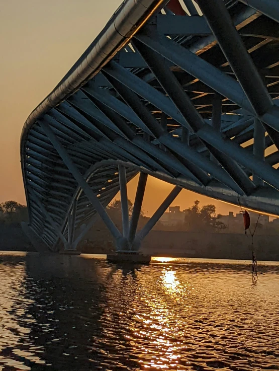 a river with a bridge over it that runs through the water