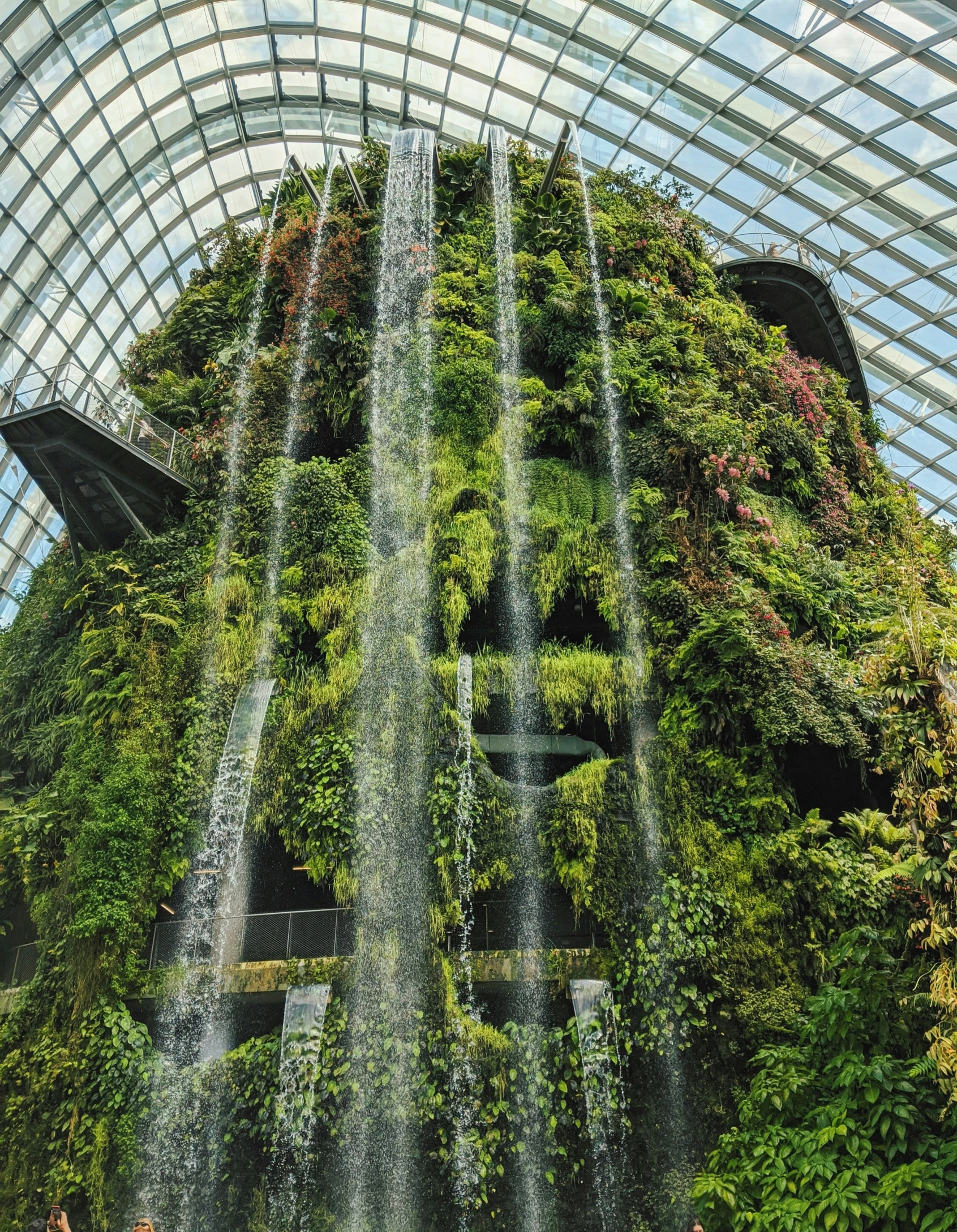 the inside of a building with large fountains in the center