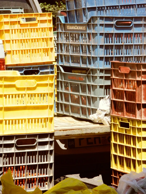 three yellow, red and white crates stacked on top of each other
