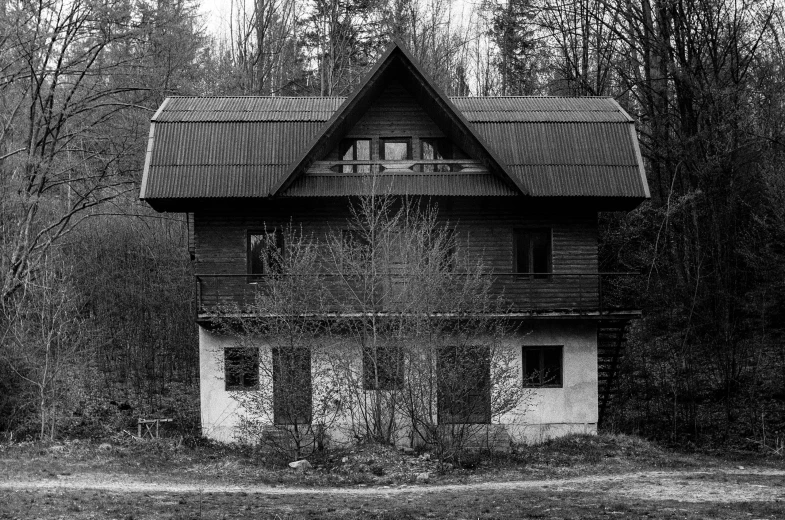 an old rundown home in black and white