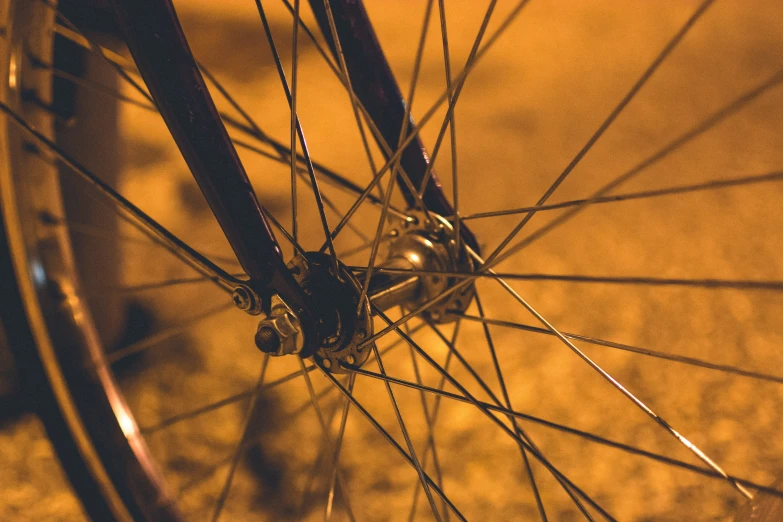 an image of a bike spokes and wheels at night