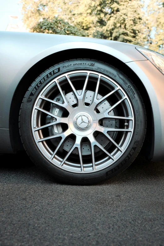 a car parked on a parking lot with the front tire