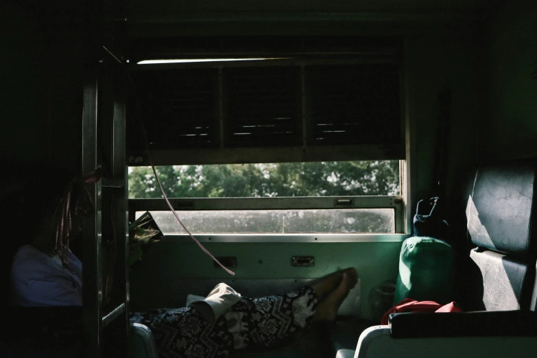 view of a seat area in a train in the dark