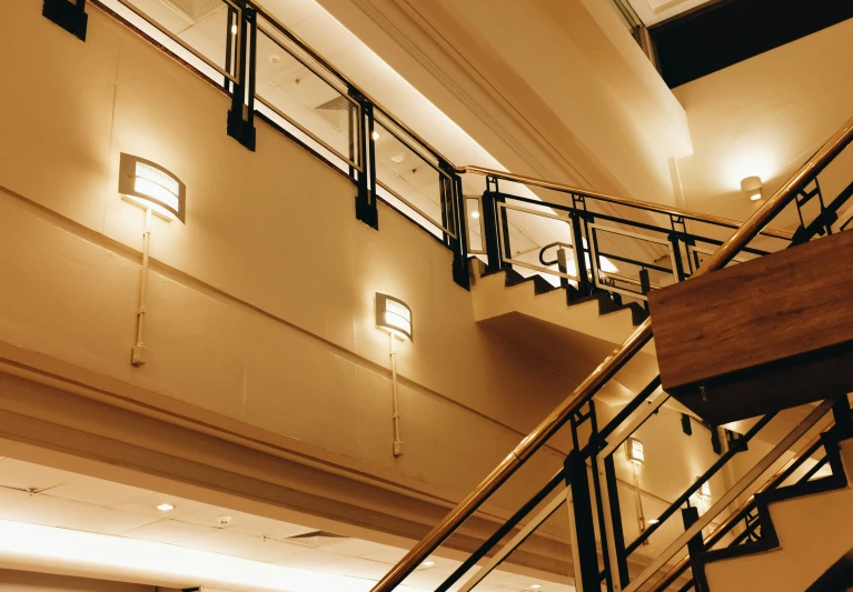 a staircase with stairs and lights in a building