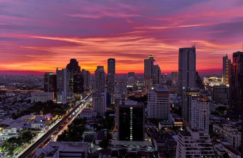 city at sunset with pink and blue sky