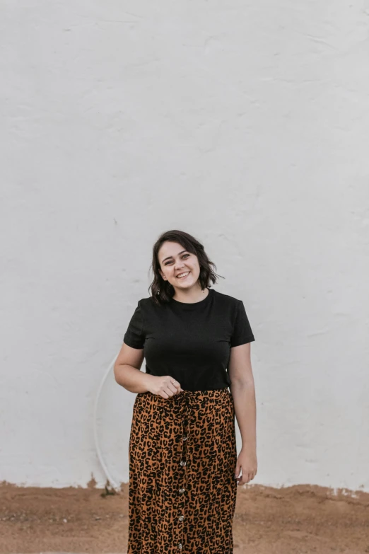 woman wearing an animal print skirt with a black shirt