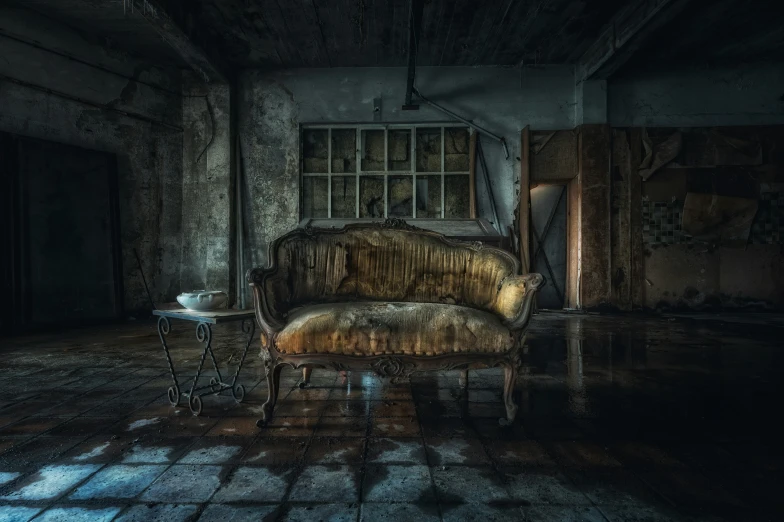 a chair and side table sit on the dark room