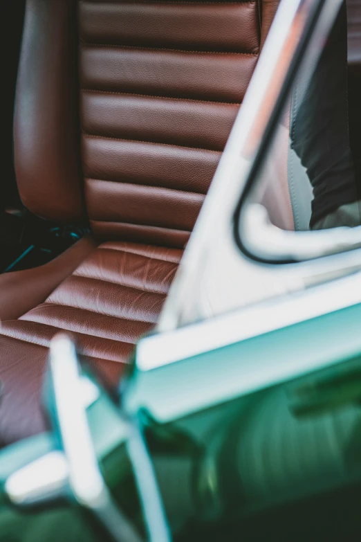 the inside view of a car that is in brown leather