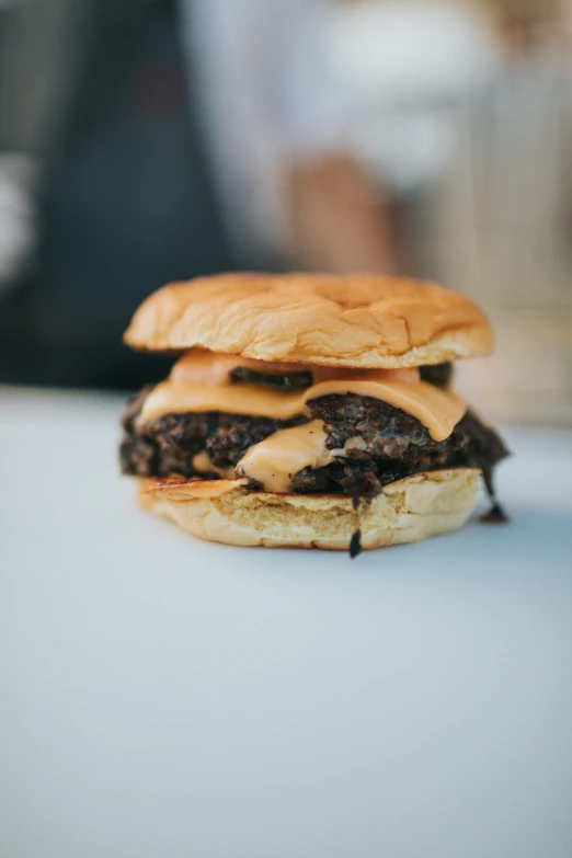 a closeup of a hamburger that looks like it is covered in brown sauce