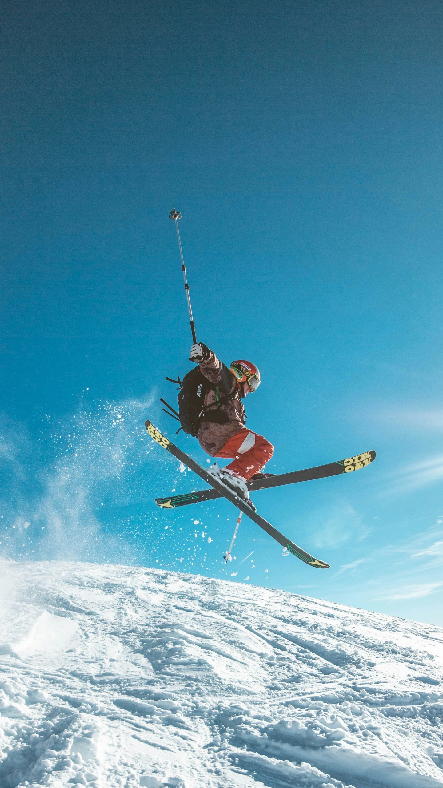 a man on skis making a jump in the air