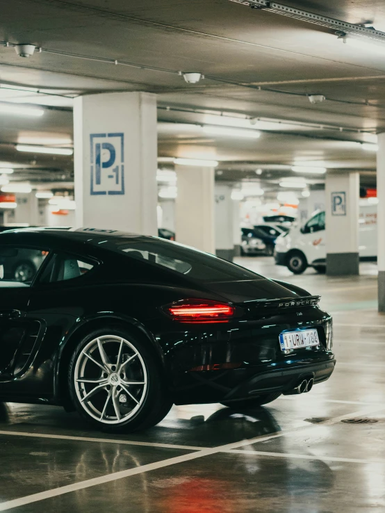 a car parked in a parking garage with no parking signs