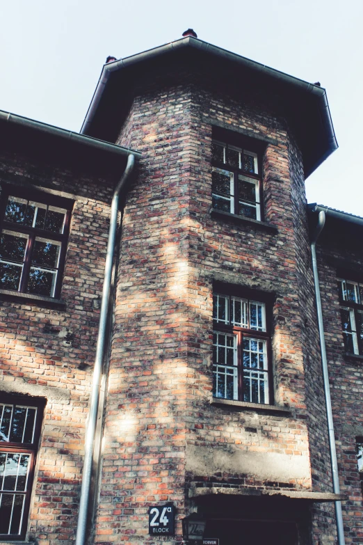 the brick building is covered with windows and an awning