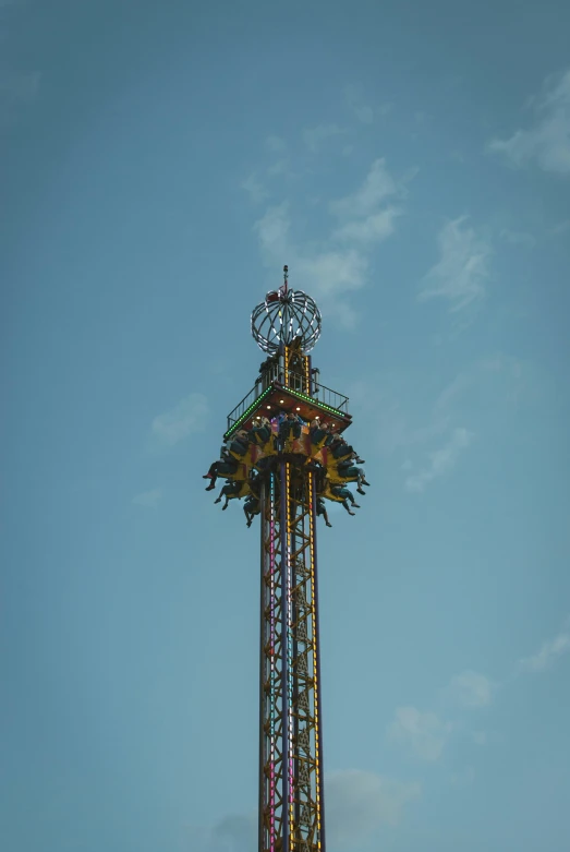 the carnival rides are in a very tall tower