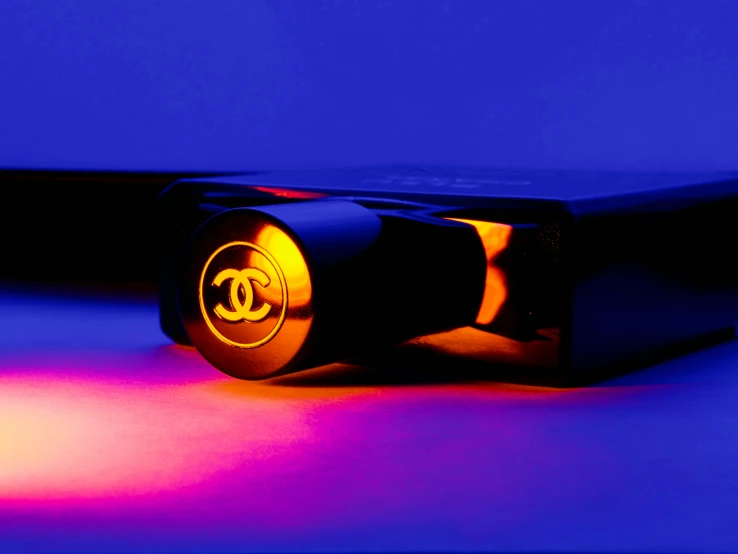 a purple, black and yellow object with bright light