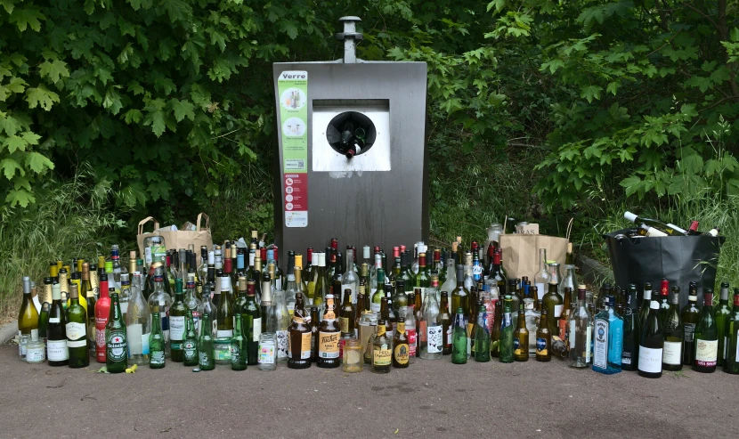 a number of different bottles with trees in the background