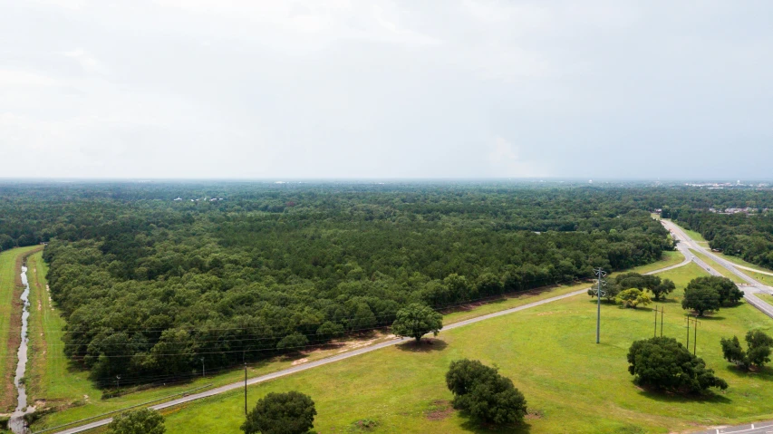 an aerial view of a rural, forested area