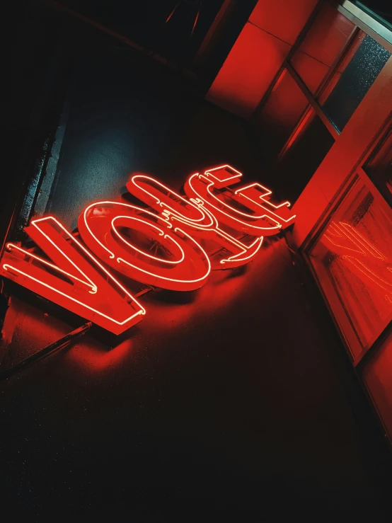 a lit up neon sign that reads wooho in red