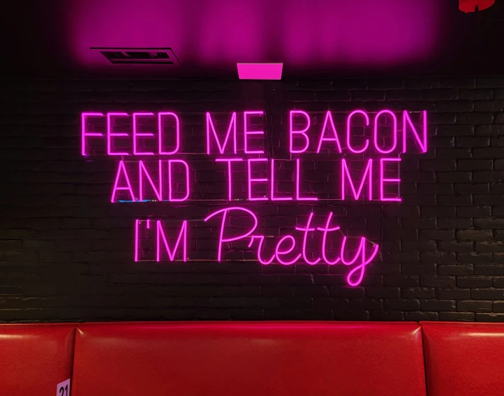 neon neon sign that reads feed me bacon and tell me i'm pretty