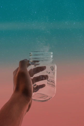 a hand holding a jar filled with water over a pink background