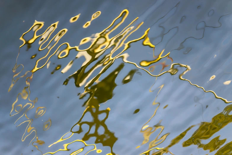 a close up view of water, with small clouds