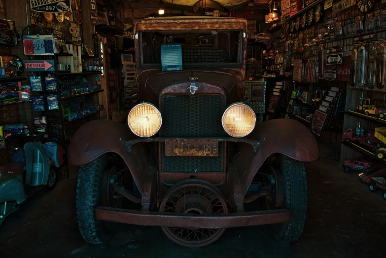 an old truck sitting in the middle of a store