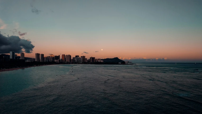 a large body of water that has some buildings in the background