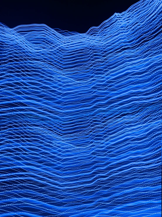 a black night with light blue wavy shapes