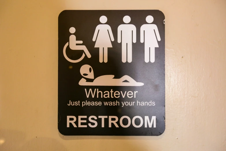 a restroom sign indicating people to be aware of what they need