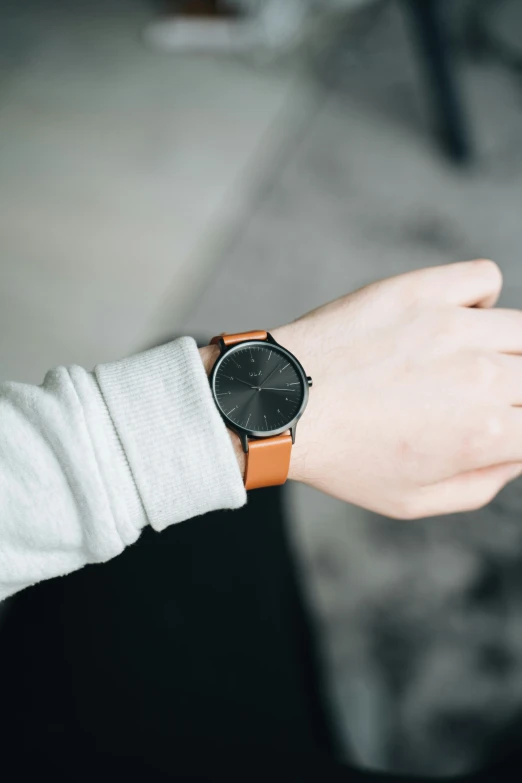 a watch on a man's wrist showing where he is going