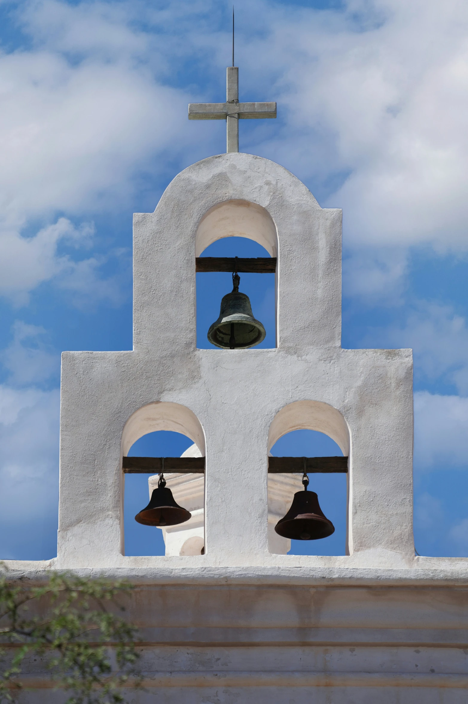 three bell towers are viewed from the bottom