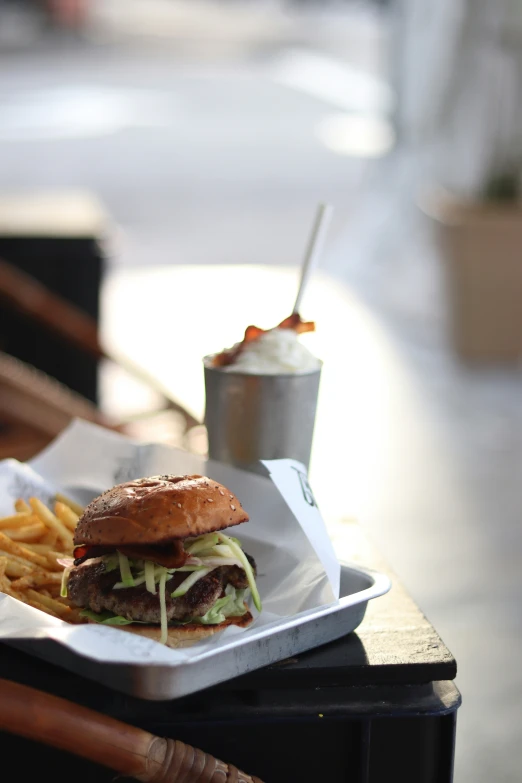 a sandwich sitting on a table with fries