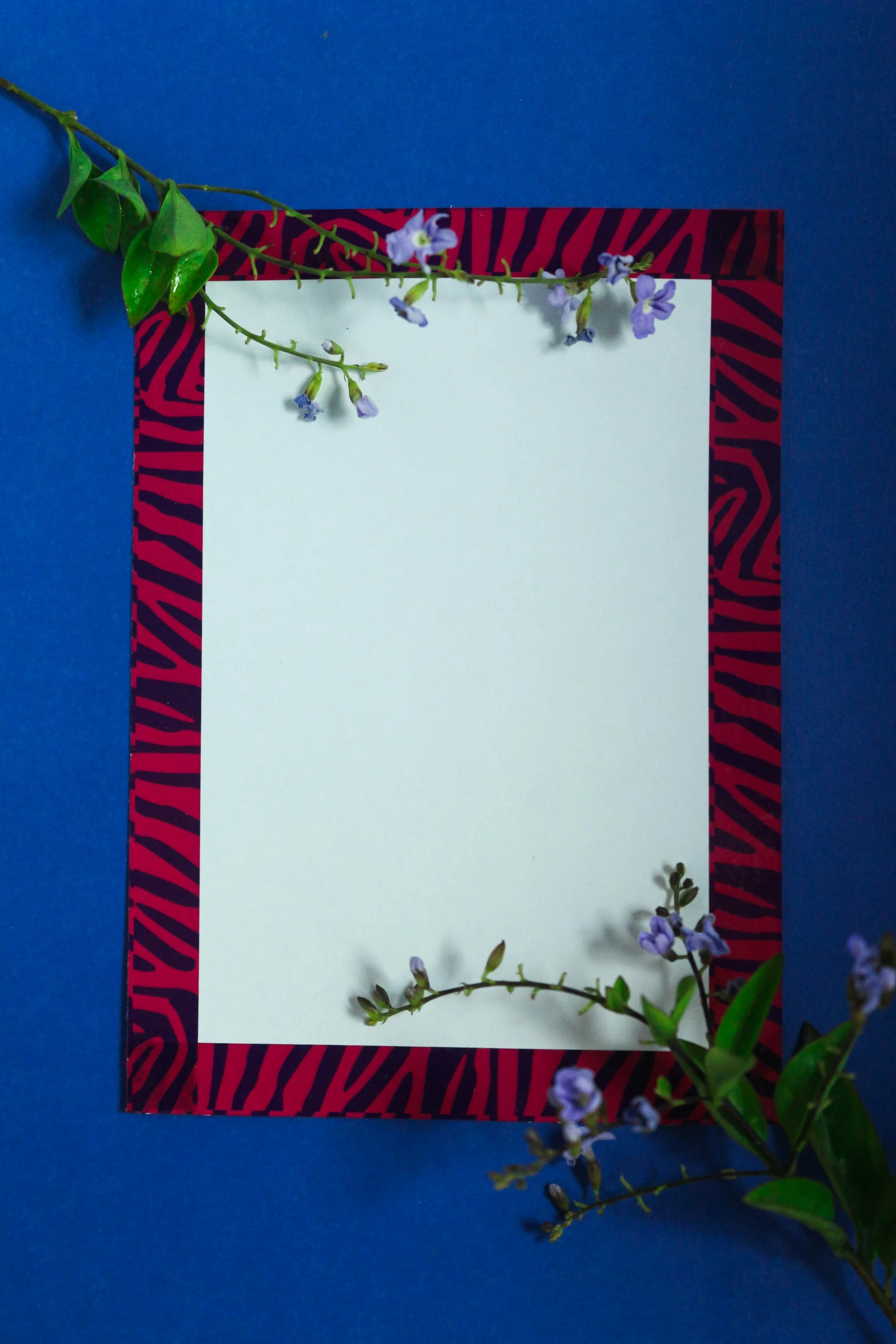 purple and red flowers and vines on white paper