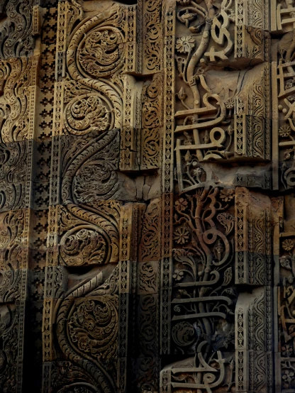 several images of a wall with intricate arabic lettering