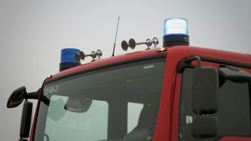 the windshield of an ambulance with a radio and other electronics on top