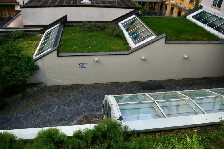 a roof with two windows on top of a building