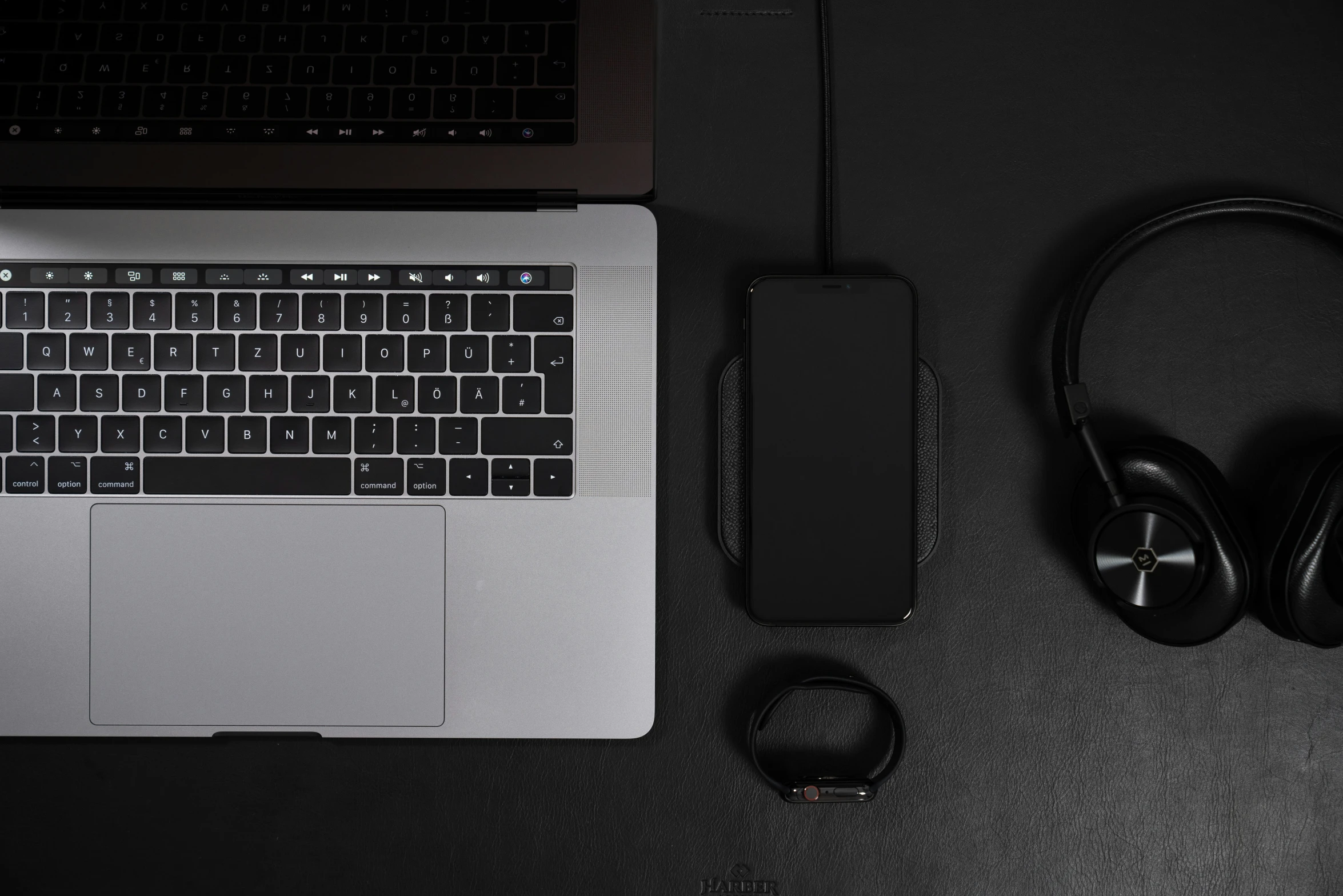 headphones and a laptop on a table