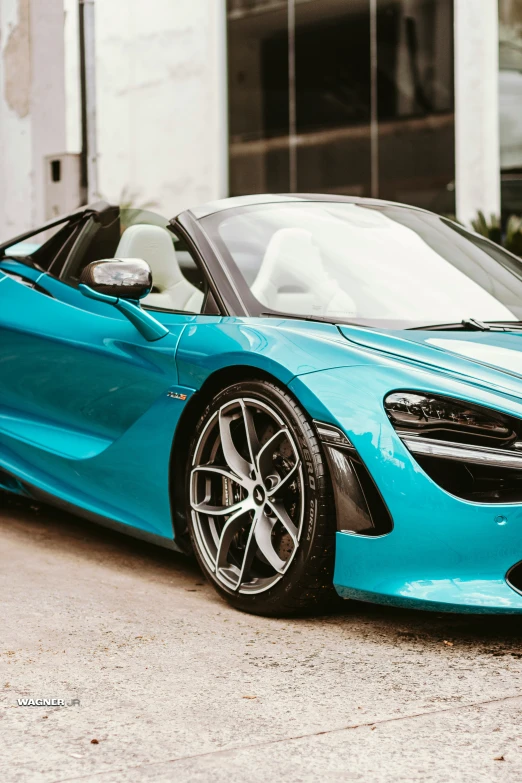 the front view of a blue sports car