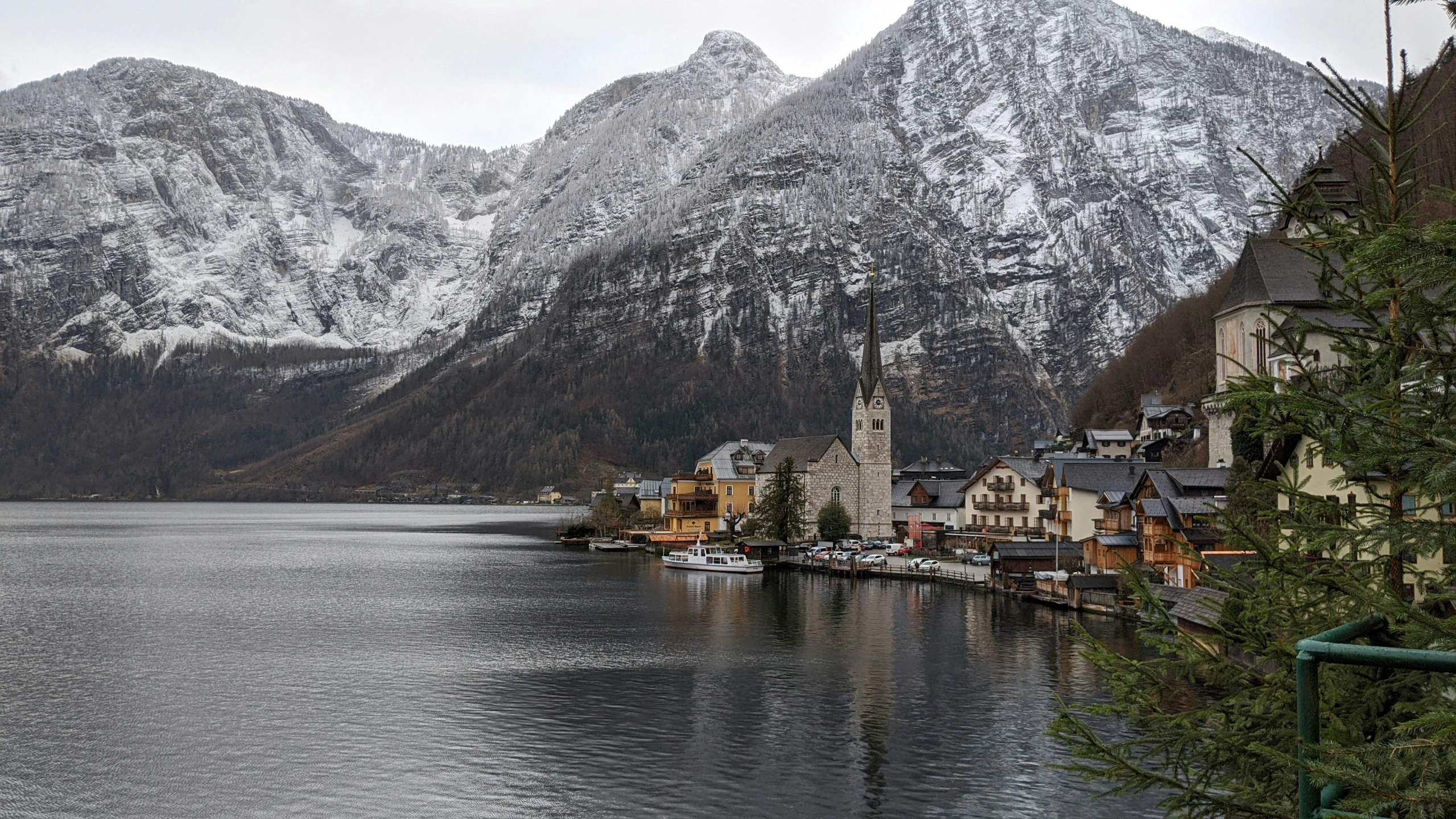 mountains surrounding a town on a lake