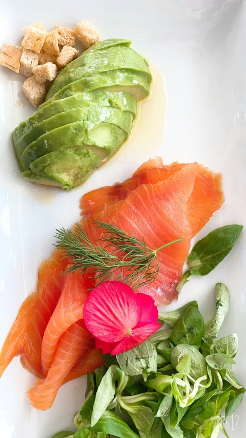 salmon and lettuce on a plate with peanuts