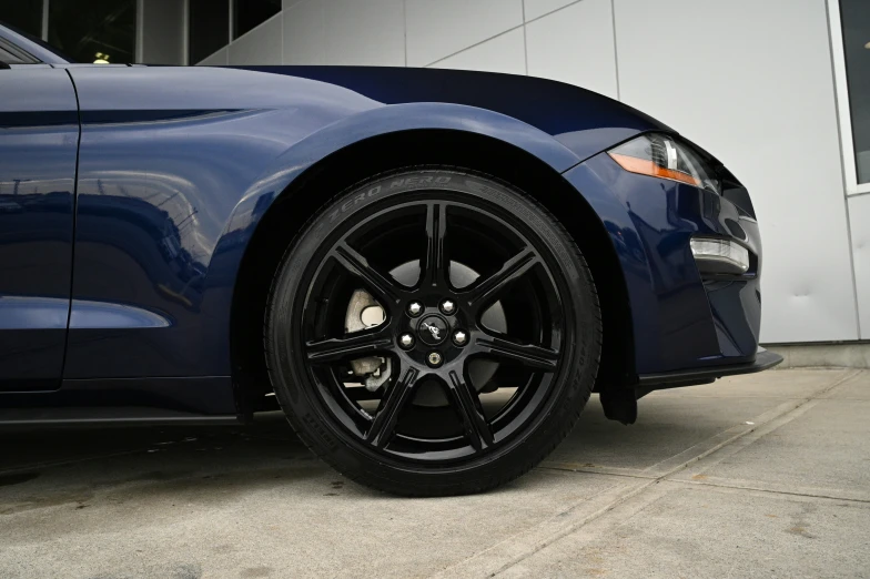 the wheels and rims of a black sports car