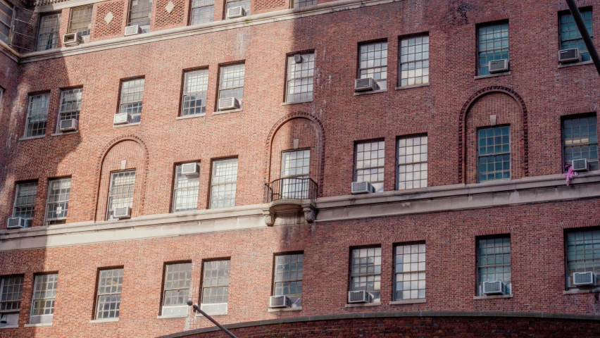 a building with lots of windows and a street light