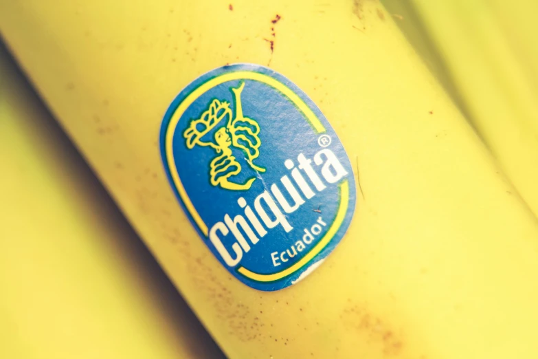 close up s of a banana showing the blue chipped logo