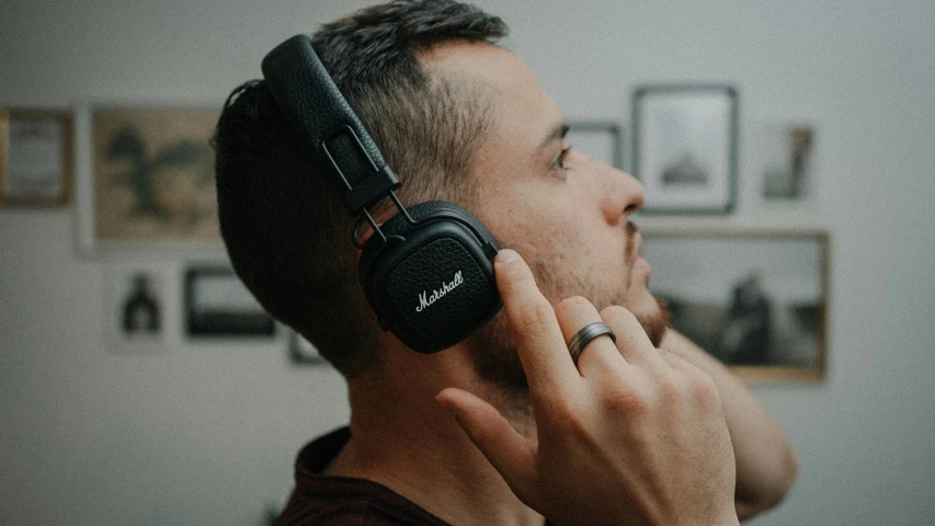 a man wearing headphones while listening to music