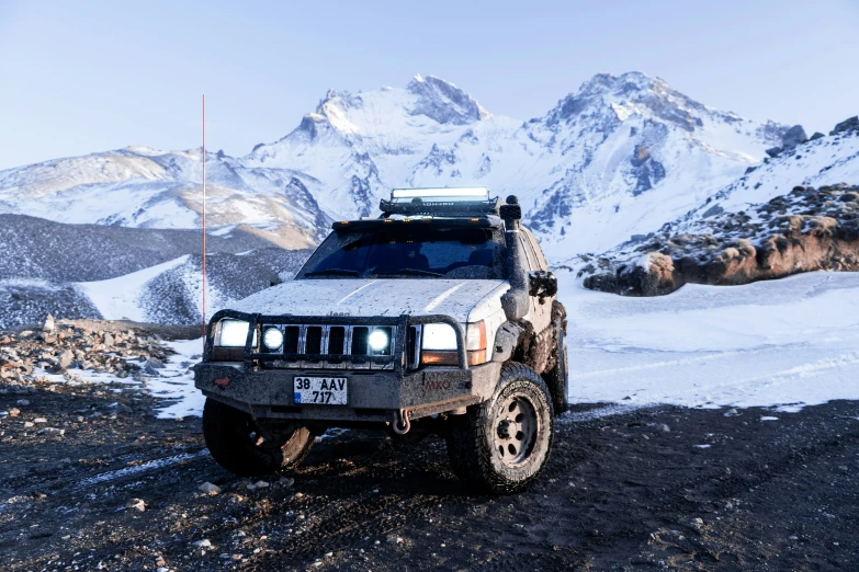 a jeep that is sitting in the dirt