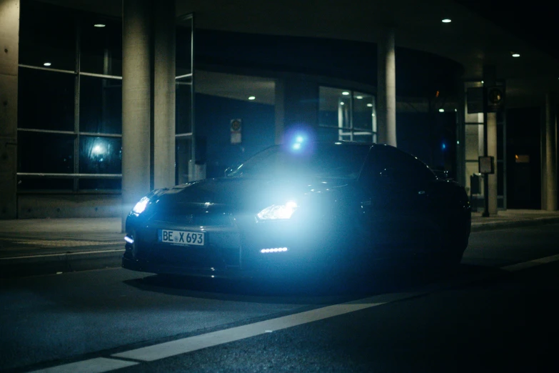 the police car is parked on the street at night