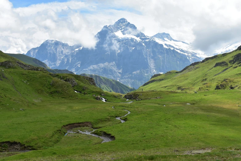 a mountain with a stream on the side