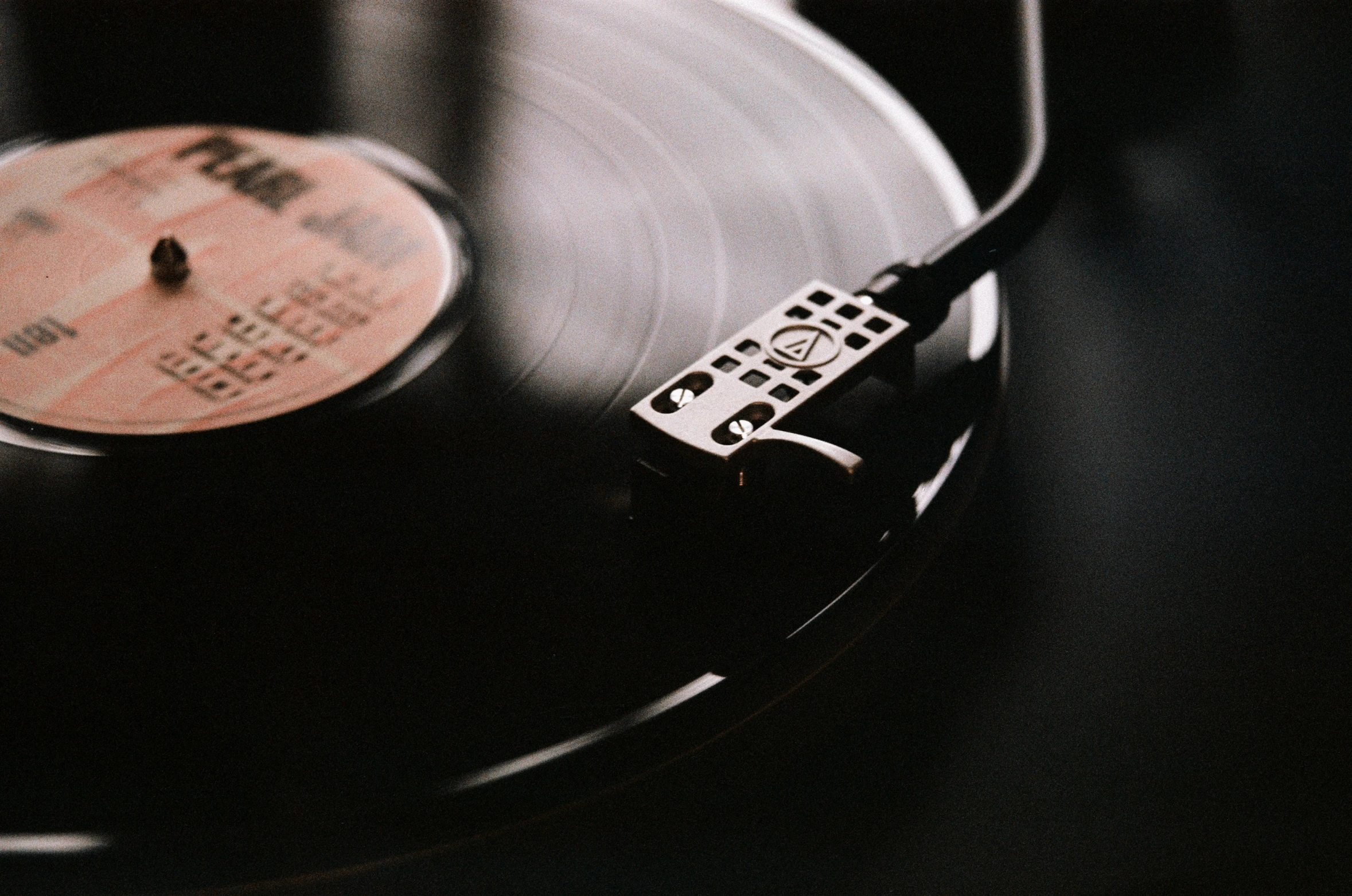 a record player is turned on with their turntable