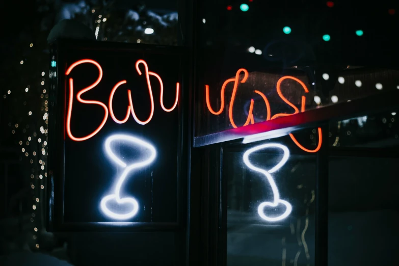 a sign in a window that has neon writing on it